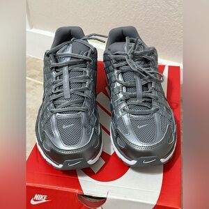 Nike P-6000 sneakers in the Metallic Cool Grey color (Size M9/W10.5).